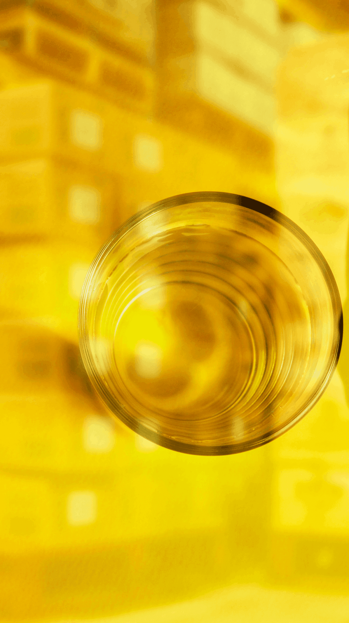 Top view of a glass containing a golden spirit